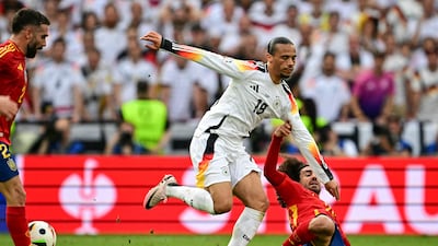 On the fringes of the game before half-time withdrawal. AFP