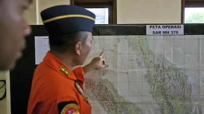An Indonesia air force officer shows a map of Malacca Straits during a briefing prior to a search operation for the missing Malaysia Airlines Boeing 777, at Suwondo air base in Medan, North Sumatra. Binsar Bakkara / AP Photo March 11