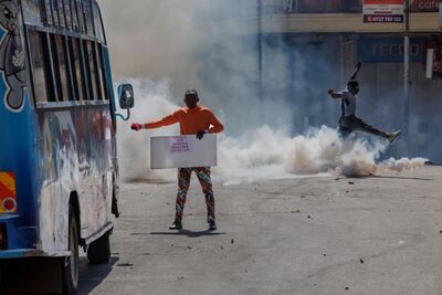 Protesters in Nairobi had tear gas fired at them by riot police during a nationwide strike to protest against new tax measures. AFP
