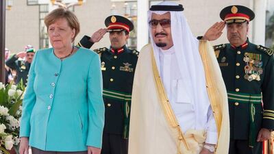 German Chancellor Angela Merkel, left, is received by Saudi King Salman on her arrival to Jeddah, Sunday, April 30, 2017. (Saudi Press Agency via AP)