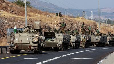 A convoy of Israeli Armoured Personnel Carriers drives near Israel's border with Lebanon, northern Israel, October 9. Reuters
