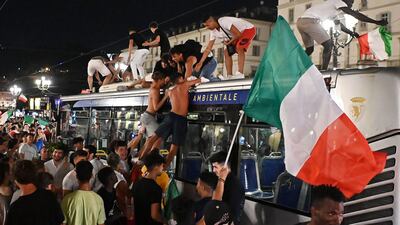 Italy fans celebrate in Turin.