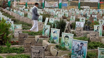 A man walks through a Sanaa cemetery for people killed in Yemen's war. EPA