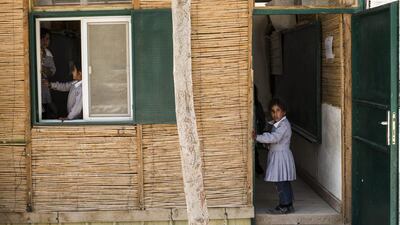 Pupils take part in a classroom activity.