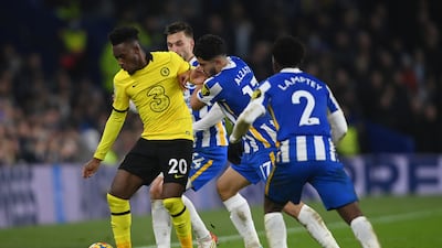 Callum Hudson-Odoi of Chelsea is pressured by Steven Alzate and Tariq Lamptey of Brighton. Getty Images