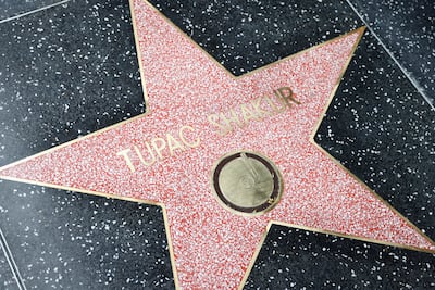 In June, Tupac Shakur posthumously received the Hollywood Walk of Fame star. EPA