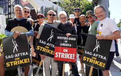 Cast and writers from Breaking Bad and Better Call Saul pose on a picket line outside Sony Pictures studios. AP