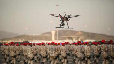 A drone is used to record a military parade by Saudi security forces in preparation for the annual Hajj pilgrimage in Mecca, Saudi Arabia. Mosa'ab Elshamy / AP
