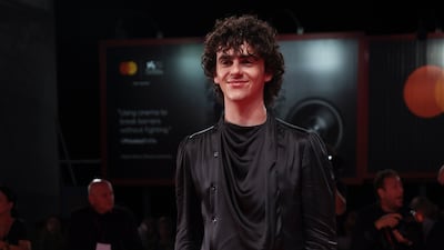 Jack Dylan Grazer, in a black top and trousers, arrives for the premiere of 'Dreamin' Wild'. AP