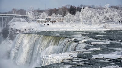 A frozen Niagara Falls seen from Stedman's Bluff on Goat Island of the American Falls. James Neiss / The Niagara Gazette via AP