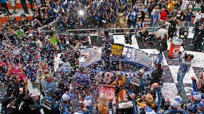 Jimmie Johnson celebrates atop his number 48 Chevrolet after he won the Nascar Sprint Cup Series Daytona 500 race. Joe Skipper / Reuters
