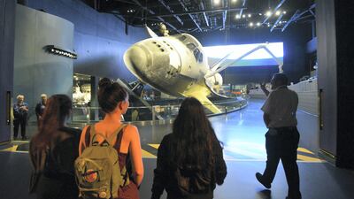 Alia Al Mansoori tours the Space Shuttle Atlantis exhibit at the Kennedy Space Center. Scott A Miller for The National