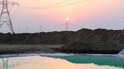 Emerald green water in the desert area of Al Wathba.