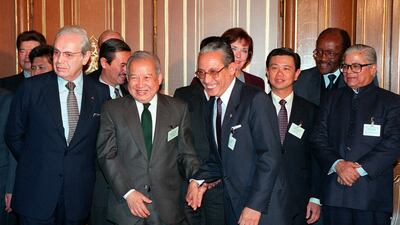 Then UN secretary general Javier Perez de Cuellar, front left, Cambodia's Prince Norodom Sihanouk, front second left, and then Philippines' foreign secretary Raul Manglapus, front , centre, with other delegates to the Cambodian Peace Conference in Paris in 1991 AFP