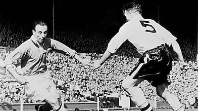 Stanley Matthews takes on Bolton's Malcolm Barrass during the 1953 FA Cup final which is know as the Matthews Final.
