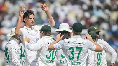 South Africa fast-bowler Marco Jansen celebrates with teammates after taking the wicket of India opener KL Rahul for one. AFP
