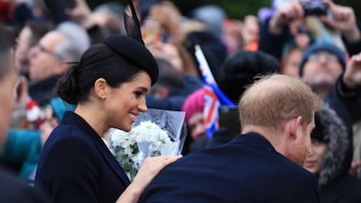 Meghan, Duchess of Sussex and Prince Harry, Duke of Sussex speak to well wishers after attending Christmas Day Church service at Church of St Mary Magdalene on the Sandringham estate in King's Lynn, England. Getty