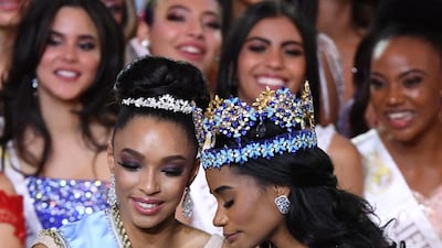 Miss World 2019 Miss Jamaica Toni-Ann Singh (R) reacts after being crowned with Miss Europe, Miss France Ophely Mezino (L) EPA
