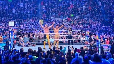 Logan Paul and The Miz celebrate their tag team win at WrestleMania 38.