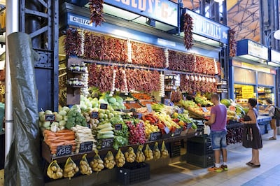 Shoppers in the Great Market Hall, Budapest. Mo Peerbacus / Alamy Stock Photo