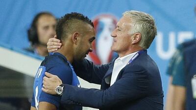 France’s Dimitri Payet is congratulated by head coach Didier Deschamps as he is substituted. John Sibley / Reuters