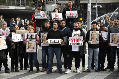 Demonstrators in Stockholm hold portraits of Swedish-Iranian doctor and researcher Ahmadreza Djalali, imprisoned under a sentence of death in Iran. AFP