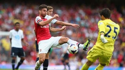 Arsenal, in red, and Tottenham Hotspur are arch London rivals. Clive Mason / Getty Images