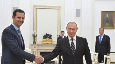 Russian president Vladimir Putin with his Syrian counterpart, Bashar Al Assad, during a meeting at the Kremlin in Moscow, Russia, in 2015. Alexei Druzhinin / Reuters