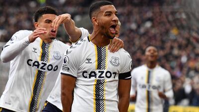 Everton defender Mason Holgate celebrates with teammates after levelling the scores. AFP