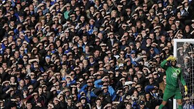 Everton goalkeeper Tim Howard shields his eyes from the sun during their English Premier League soccer match against Tottenham Hotspur at Goodison Park. Phil Noble / Reuters