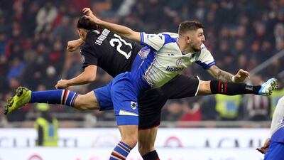 latan Ibrahimovic and Sampdoria's Julian Chabot battle for the ball. EPA