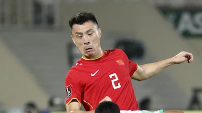 China's defender Zheng Zheng pressures Saudi Arabia midfielder Hattan Bahebri. AFP