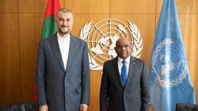 UNGA President Abdulla Shahid, right, meets with Iran's Foreign Minister Hossein Amir-Abdollahian during the 76th session of the UN General Assembly. United Nations / Evan Schneider via AP