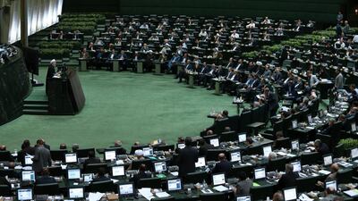 Iranian President Hassan Rouhani speaks in a session of the parliament while answering questions of lawmakers, in Tehran. Vahid Salemi / AP