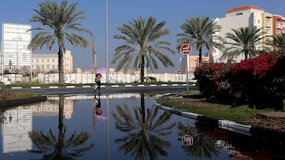 Waterlogged roads in International City, Dubai. Satish Kumar / The National