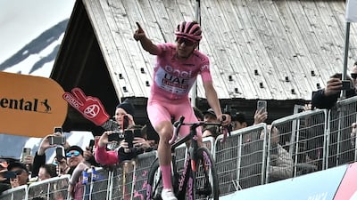 Slovenian rider Tadej Pogacar of the UAE Team Emirates celebrates after crossing the finish line. EPA