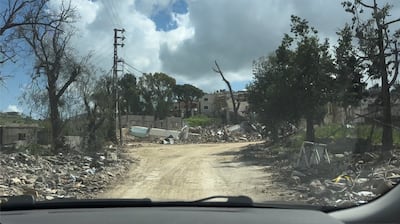 Destruction in Dibbin after Israeli troops advanced on the area. Nada Atallah / The National