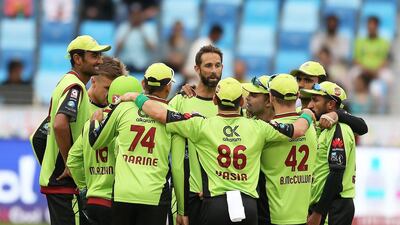 Grant Elliott, centre, has been a standout player for Lahore Qalandars in the Pakistan Super League this season. Pawan Singh / The National