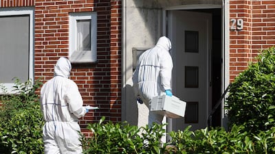 Officers enter the youth centre where the fatal shooting took place in Stade. AFP