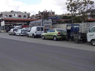 Vehicles queue for fuel in the town of Hama in western Syria. Anadolu Agency via Getty Images