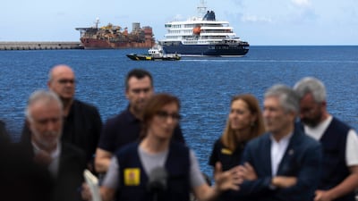MV Hondius is seen while Spain's Ministers for Health Monica Garcia, centre, says a total of 94 passengers and crew members have been evacuated from the stricken cruise ship. EPA