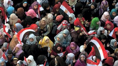 Women gather at Tahrir Square, Cairo, on February 18, 2011 during celebrations to mark one week since Egypt’s long-time president Hosni Mubarak was forced from office by mass protests. AFP
