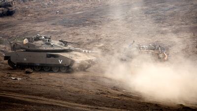 Israeli Merkava tanks train at the Golan Heights area on the Israeli-Syrian border on October 16, 2107. Atef Safadi / EPA