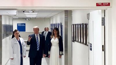 Donald Trump, accompanied by his wife Melania Trump and trauma surgeon Dr Igor Nichiporenko during a visit to the victims of the Parkland school shooting, at the Broward Health North medical centre in Pompano Beach, Florida. EPA