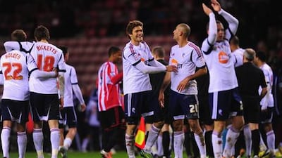 Bolton players celebrate after their FA Cup third round replay win over Sunderland.