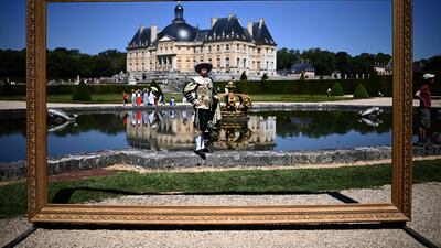 A man poses in 17th-century costume during historical festival at Vaux-le-Vicomte castle in Maincy, France. AFP