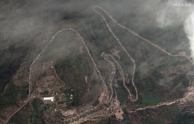 A satellite image shows a long traffic jam of vehicles along the Lachin corridor. Maxar Technologies/Reuters
