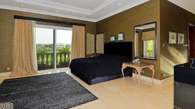 Wake up and smell the golf. There's a view of the course from this bedroom, one of five in the property. Courtesy Better Homes