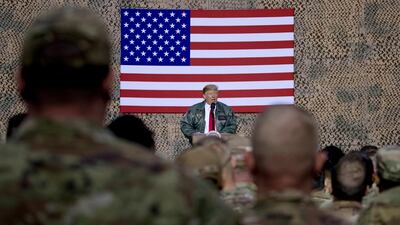 US President Donald Trump speaks to members of the military at a hangar rally at Al Asad Air Base, Iraq, on December 28, 2018. AP