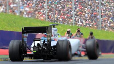 Williams F1 driver Felipe Massa passes by photographers as he competes in the Austrian Grand Prix at the Red Bull Ring in Spielberg on Sunday. Joe Klamar / AFP